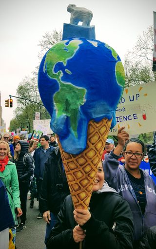 People called attention to the reality of climate change during the March for Science in New York City.