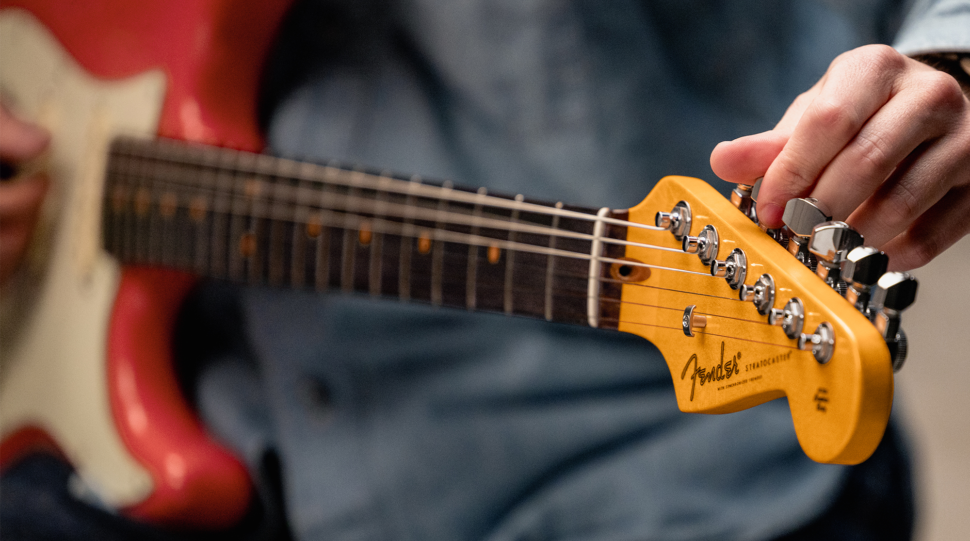 A detail photo of the Fender American Ultra Luxe Vintage &amp;rsquo;60s Stratocaster HSS in Fiesta Red