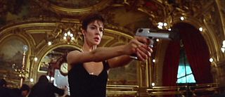 Nikita (Anne Parillaud) shoots her intended target during the restaurant shootout in