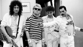 Queen standing outside their dressing room