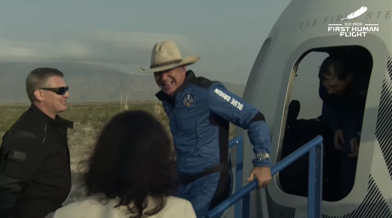 Jeff Bezos shows his elation as he exits the New Shepard capsule.