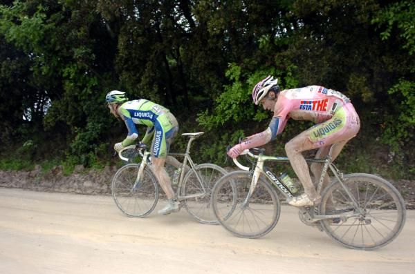 Liquigas-Doimo teammates Ivan Basso and Vincenzo Nibali strain as they try to bridge back to the lead group
