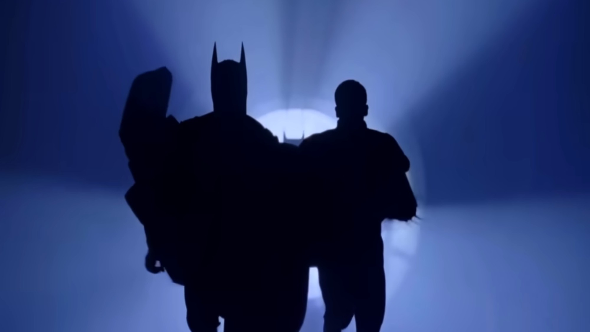 Silhouettes of Batman and Robin running in Batman Forever