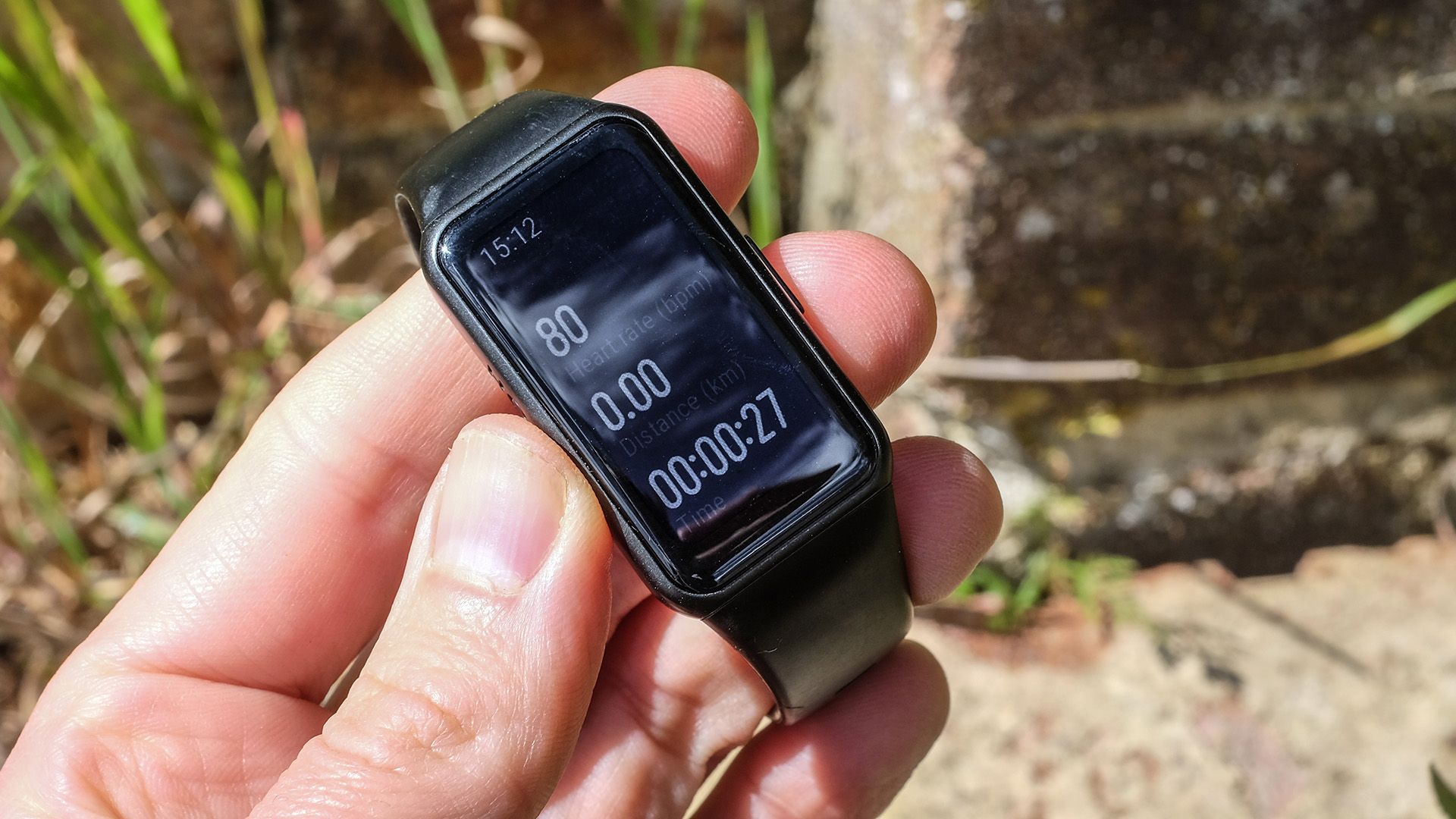 Our tester holds the Honor Band 6 fitness tracker