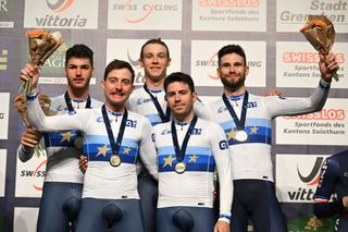 Italys Manlio Moro L Simone Consonni 2nd L Jonathan Milan C Francesco Lamon 2nd R and Filippo Ganna R celebrate on the podium after winning the gold medal of the Mens Team Pursuit during the UEC Track Elite European Championship in Grenchen on February 9 2023 Photo by SEBASTIEN BOZON AFP Photo by SEBASTIEN BOZONAFP via Getty Images