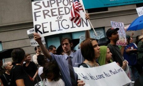 Supporters of the proposed Muslim community center near Ground Zero in lower Manhattan chant slogans and carry signs during a demonstration. 