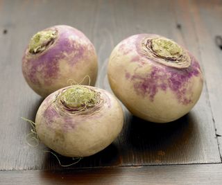 Raw turnips on a wooden table