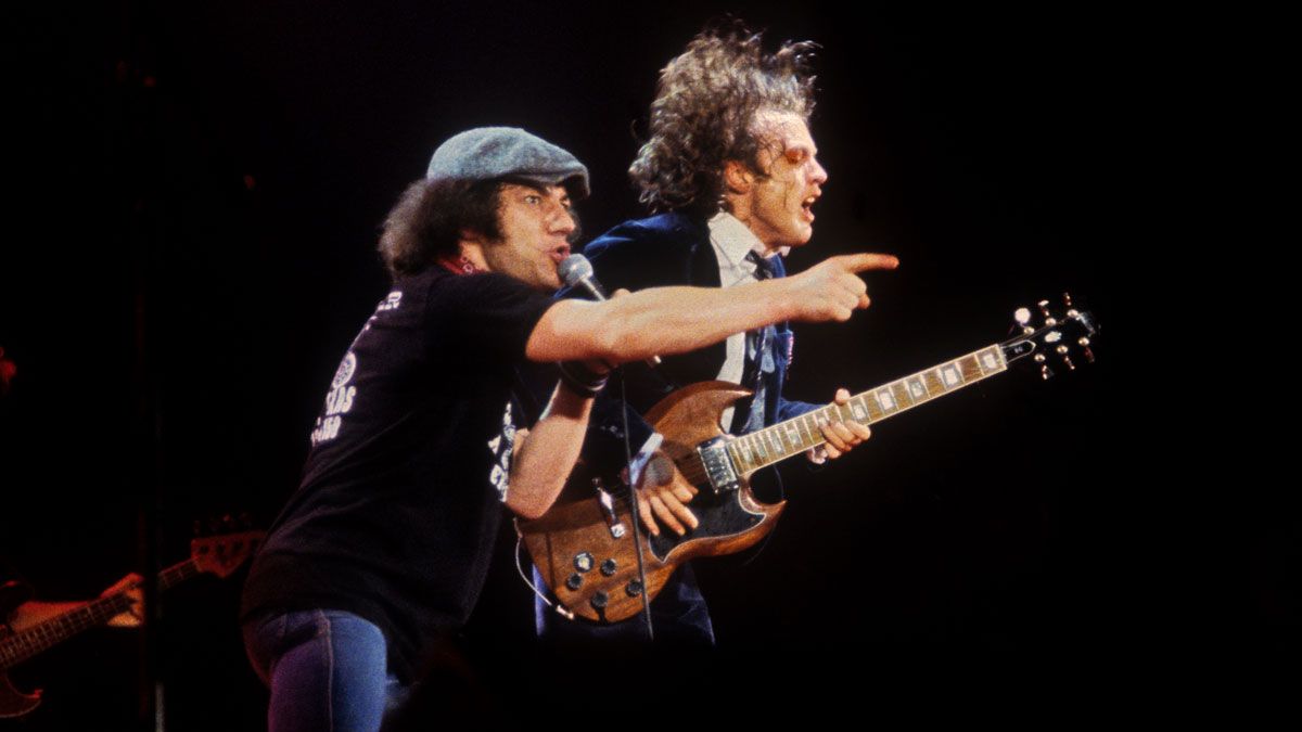 Brian Johnson (left) and Angus Young from AC/DC perform live on stage at the Cow Palace in San Francisco on February 16, 1982.