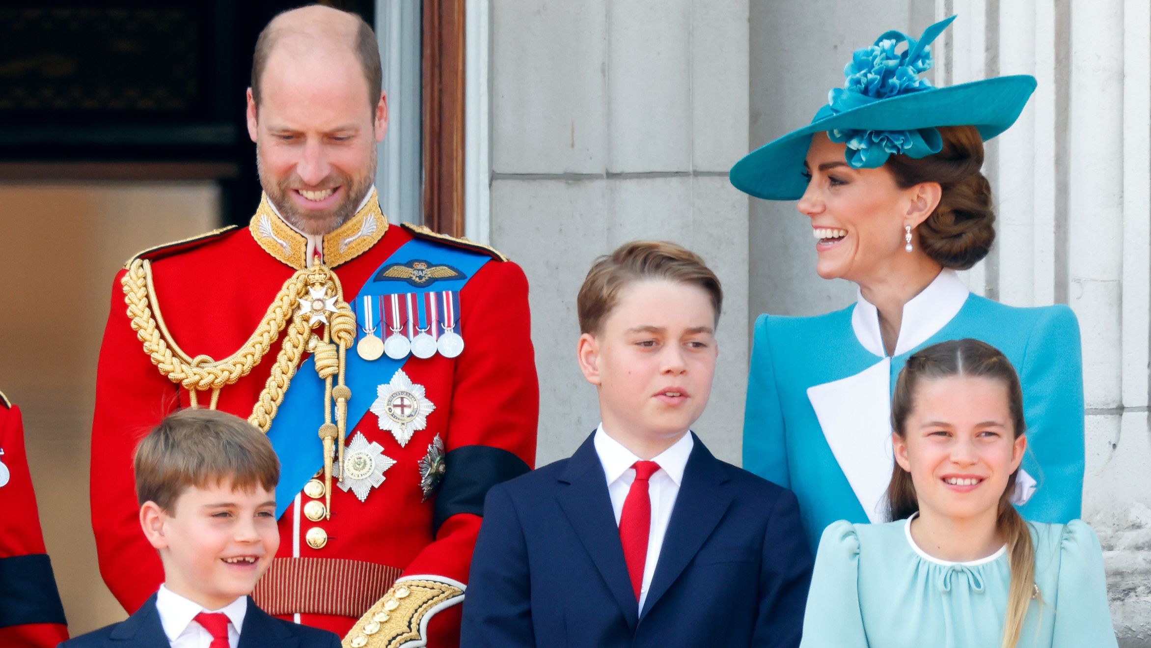 Prince Louis, Prince William, Prince George, Catherine, Princess of Wales and Princess Charlotte watch an RAF flypast from the balcony of Buckingham Palace after attending Trooping The Colour 2025