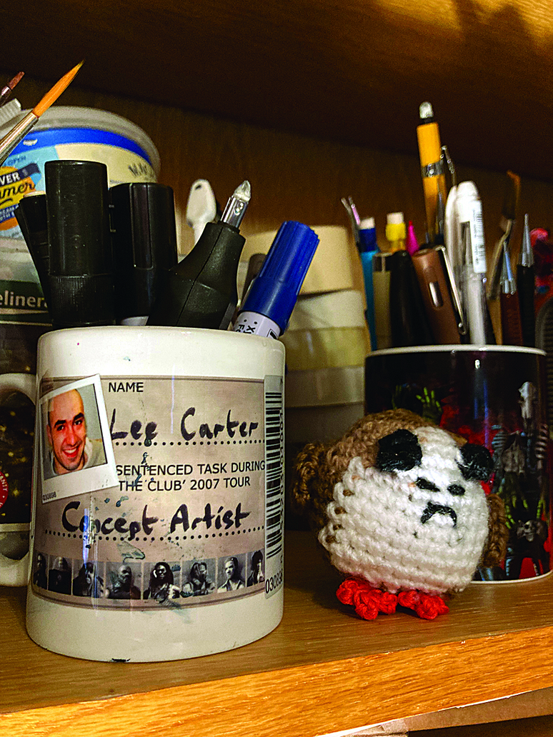 Artist in residence; mug next to a crocheted porg