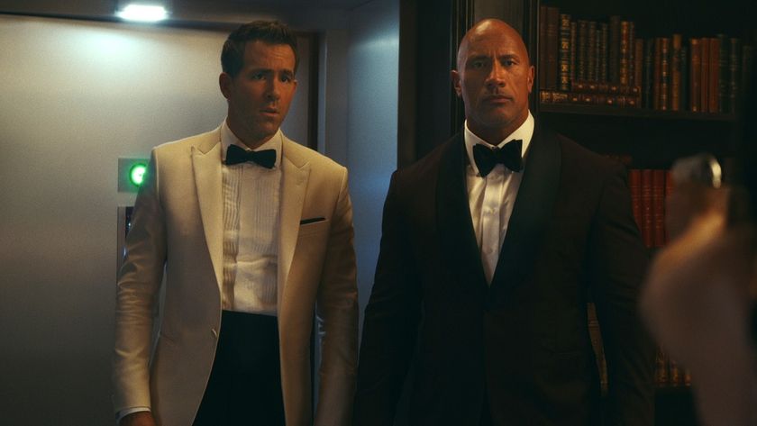 Dwayne Johnson and Ryan Reynolds in suits in Red Notice