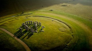 An aerial photo of Stonehenge at sunrise.