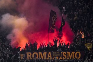 Roma fans light up the Stadio Olimpico during the derby against Lazio in November 2023.