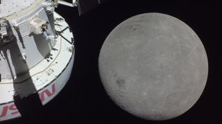 spacecraft at left and moon in behind