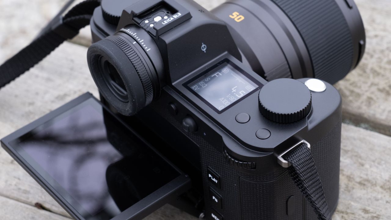 The Leica SL3 camera sat on a wooden bench