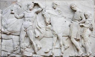 A marble frieze from the Parthenon, now displayed in the British Museum, depicts a procession of gods and mortals.