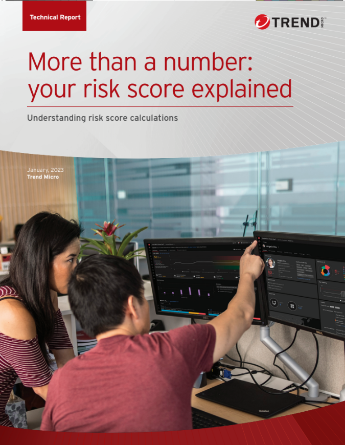 Whitepaper cover with title and logo above an image of male and female co-workers looking at a dual screen desktop workstation