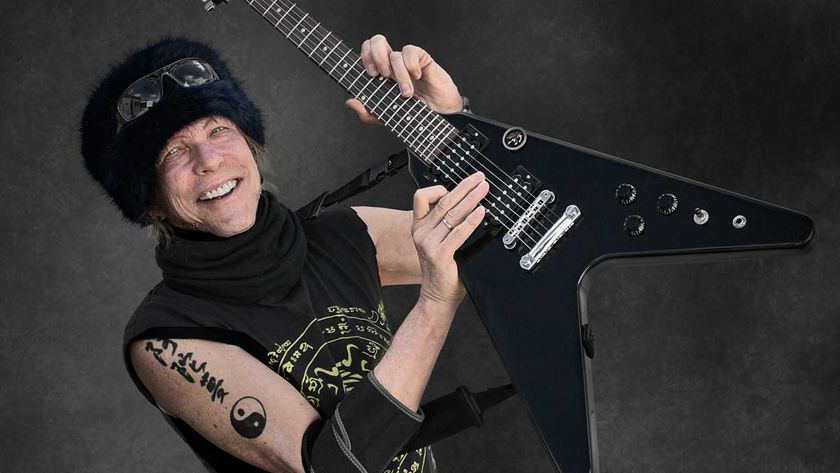 Michael Schenker wielding a Flying V guitar