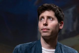 Sam Altman close up headshot on stage while giving a speech in Paris