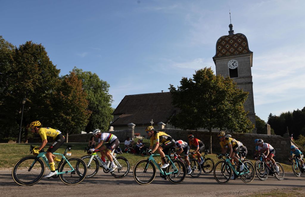 Team Jumbo rider Slovenias Primoz Roglic wearing the overall leaders yellow jersey L and the pack ride during the 19th stage of the 107th edition of the Tour de France cycling race 160 km between BourgenBresse and Champagnole on September 18 2020 Photo by Kenzo Tribouillard AFP Photo by KENZO TRIBOUILLARDAFP via Getty Images