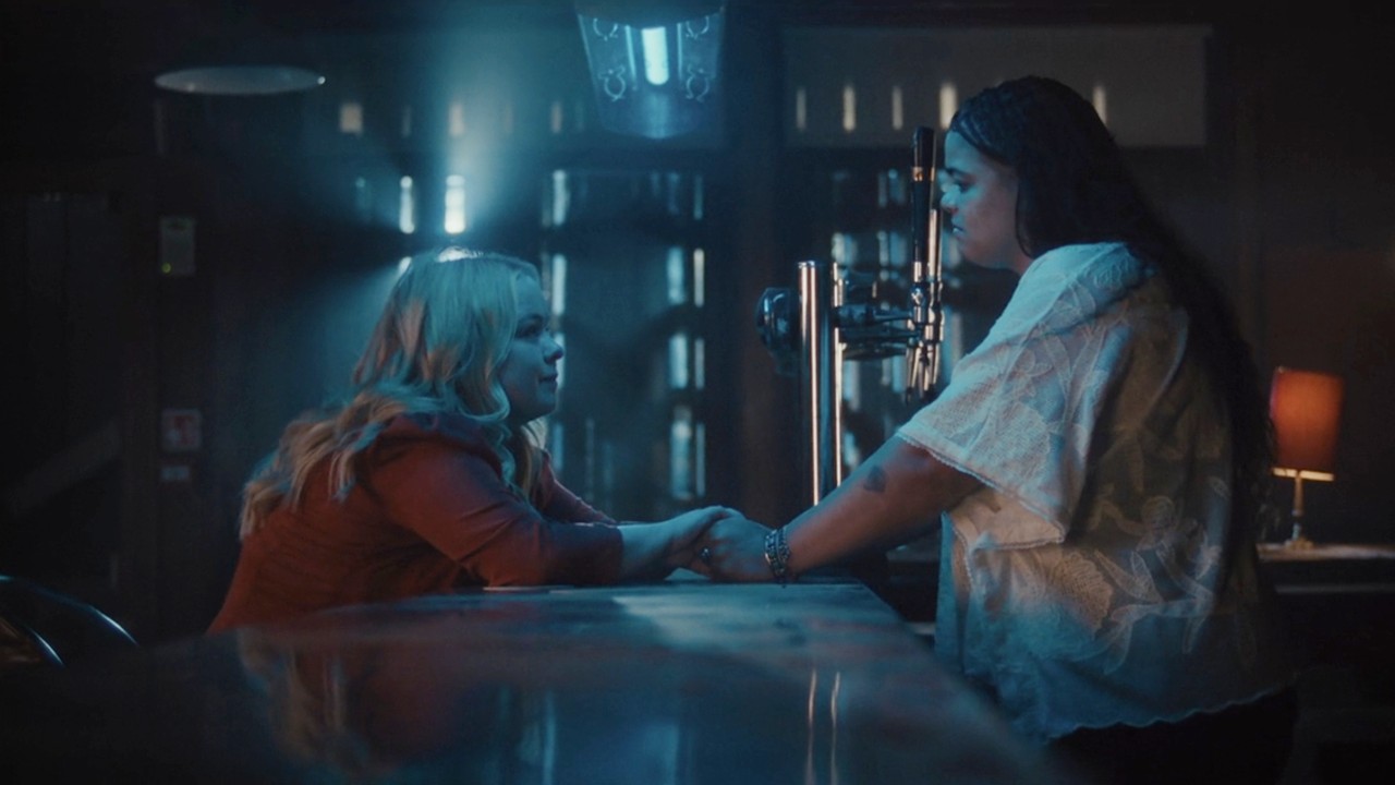 Nicola Coughlan and Lydia West holding hands in Big Mood Season 2.