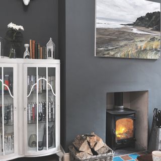 Grey living room with fireplace and white cabinet