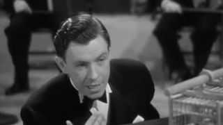 George Murphy in black and white, wearing a tuxedo in Two Girls On Broadway