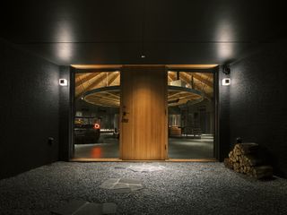 japanese house with dark round shaped interior like a circus house