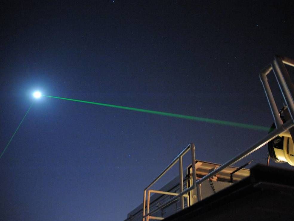 This photograph shows the laser-ranging facility at the Goddard Geophysical and Astronomical Observatory in Greenbelt, Maryland trying to hit the Lunar Reconnaissance Orbiter (LRO) with green laser light. For the first time, another facility in Grasse, France successfully bounced a laser (using infrared light) off the LRO&#039;s onboard mirror.