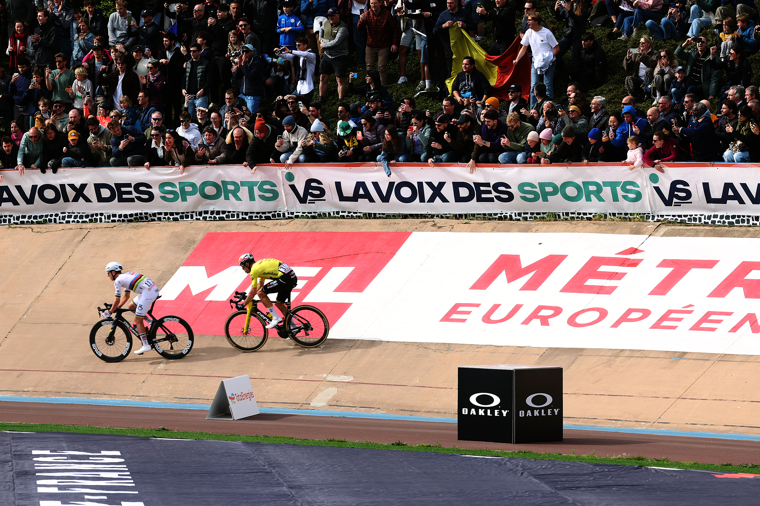 ROUBAIX, FRANCE - APRIL 12: (L-R) Tadej Pogacar of Slovenia and UAE Team Emirates - XRG and race winner Wout van Aert of Belgium and Team Visma | Lease a Bike sprint at finish line in the Roubaix Velodrome - Andre Petrieux during the 123rd Paris-Roubaix Hauts-de-France 2026 - Men&amp;apos;s Elite a 258.3km one day race from Compiegne to Roubaix / #UCIWT / on April 12, 2026 in Roubaix, France. (Photo by Rhode Van Elsen/Getty Images)