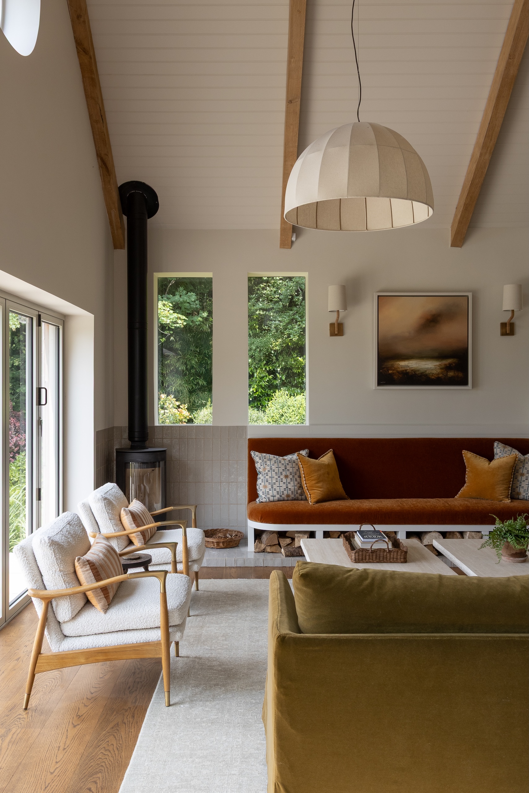 A burnt orange armless sofa in a contemporary living room