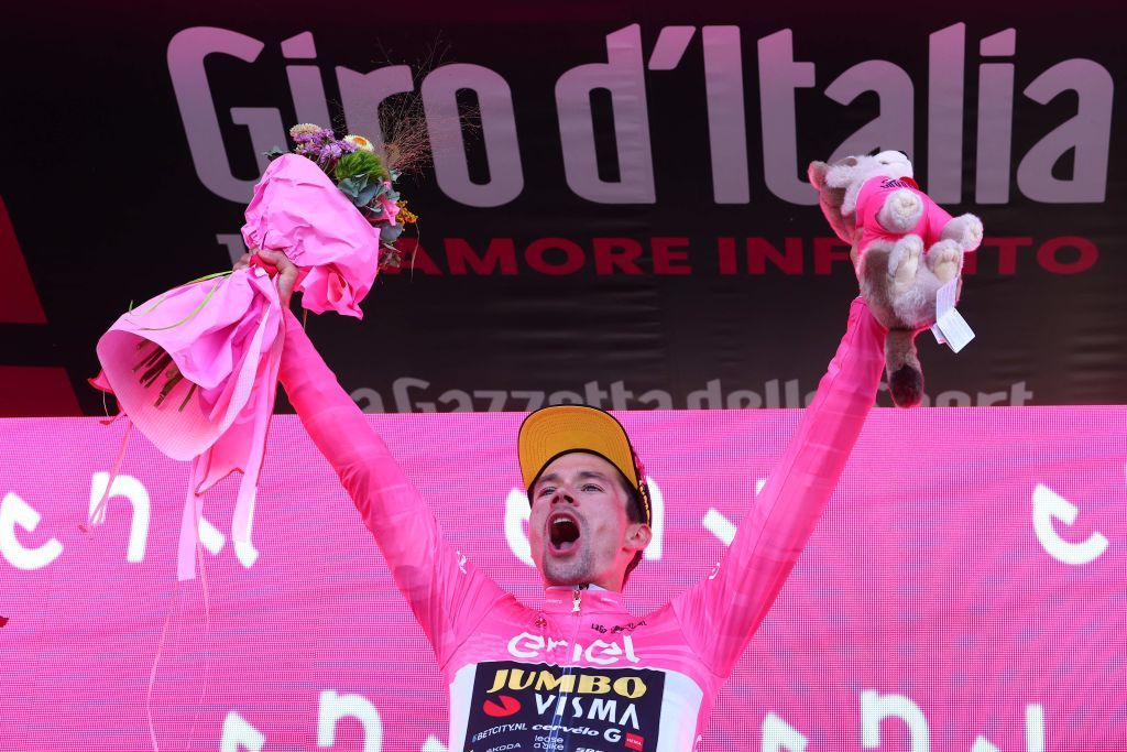 New overall leader JumboVismas Slovenian rider Primoz Roglic celebrates his overall leaders pink jersey on the podium after winning the twentieth stage of the Giro dItalia 2023 cycling race a 186 km individual time trial between Tarvisio and Monte Lussari on May 27 2023 Photo by Luca Bettini AFP Photo by LUCA BETTINIAFP via Getty Images