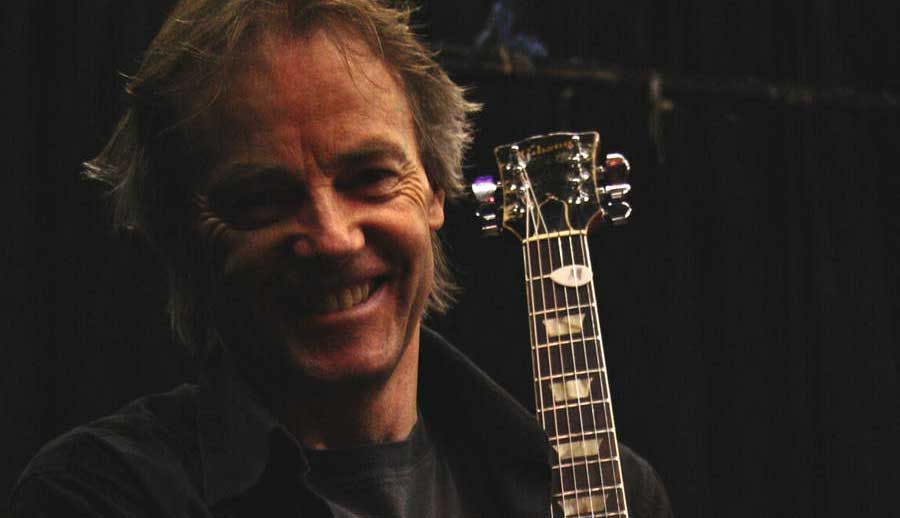 Snowy White with guitar