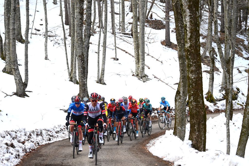 CARPEGNA ITALY MARCH 12 Tadej Pogacar of Slovenia Blue Leader Jersey Rafal Majka of Poland and UAE Team Emirates Mikel Landa Meana of Spain and Team Bahrain Victorious Richie Porte of Australia and Team INEOS Grenadiers and The Peloton compete in a snowy landscape during the 57th TirrenoAdriatico 2022 Stage 6 a 215km stage from Apecchio to Carpegna 746m TirrenoAdriatico WorldTour on March 12 2022 in Carpegna Italy Photo by Tim de WaeleGetty Images