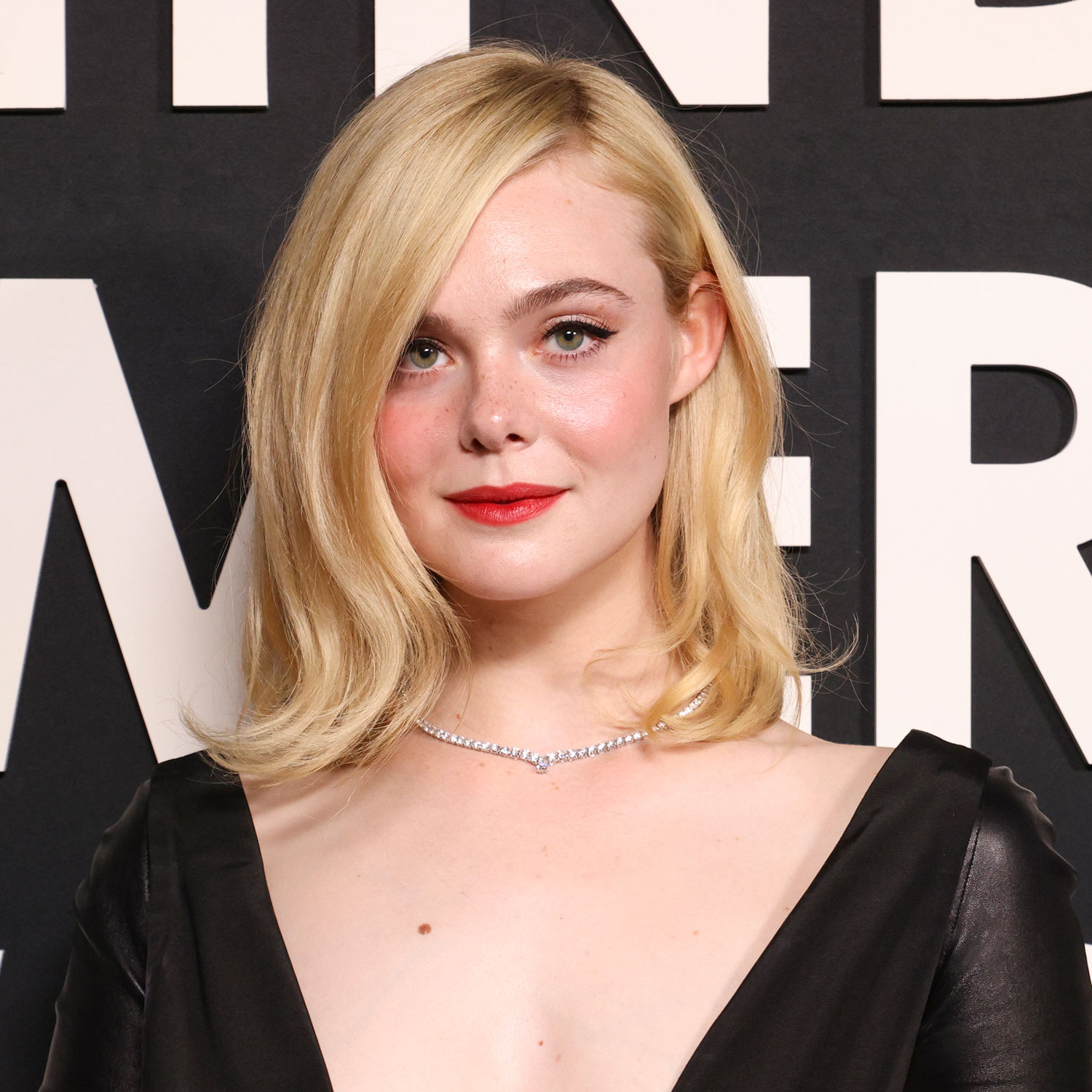 Elle Fanning's Daring Neckline and Leather Gloves Turned a Simple Black Dress Into a Fashion Moment