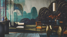 dark entryway with table and console with a large statement mural