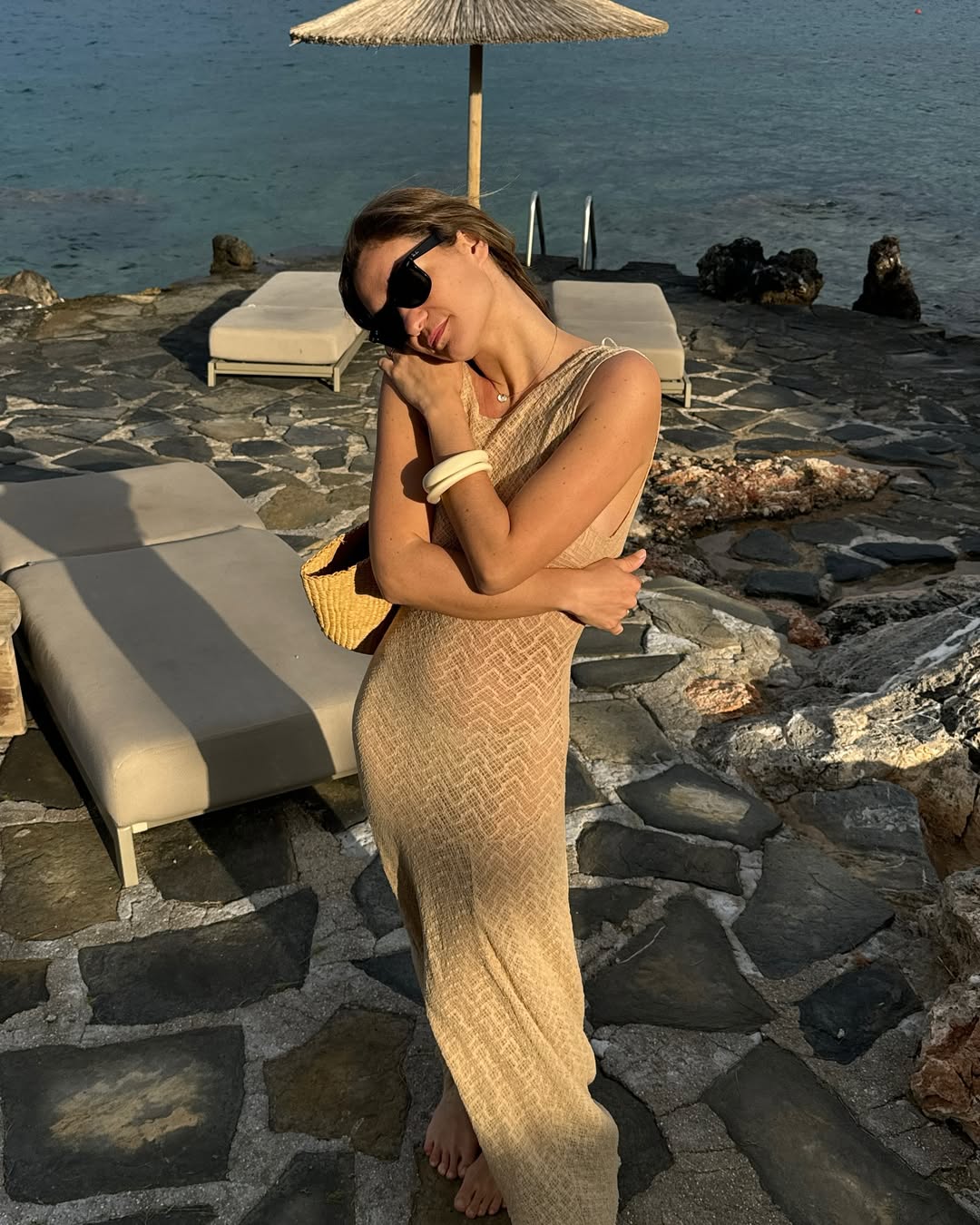Anne Laure Mais wears a maxi dress