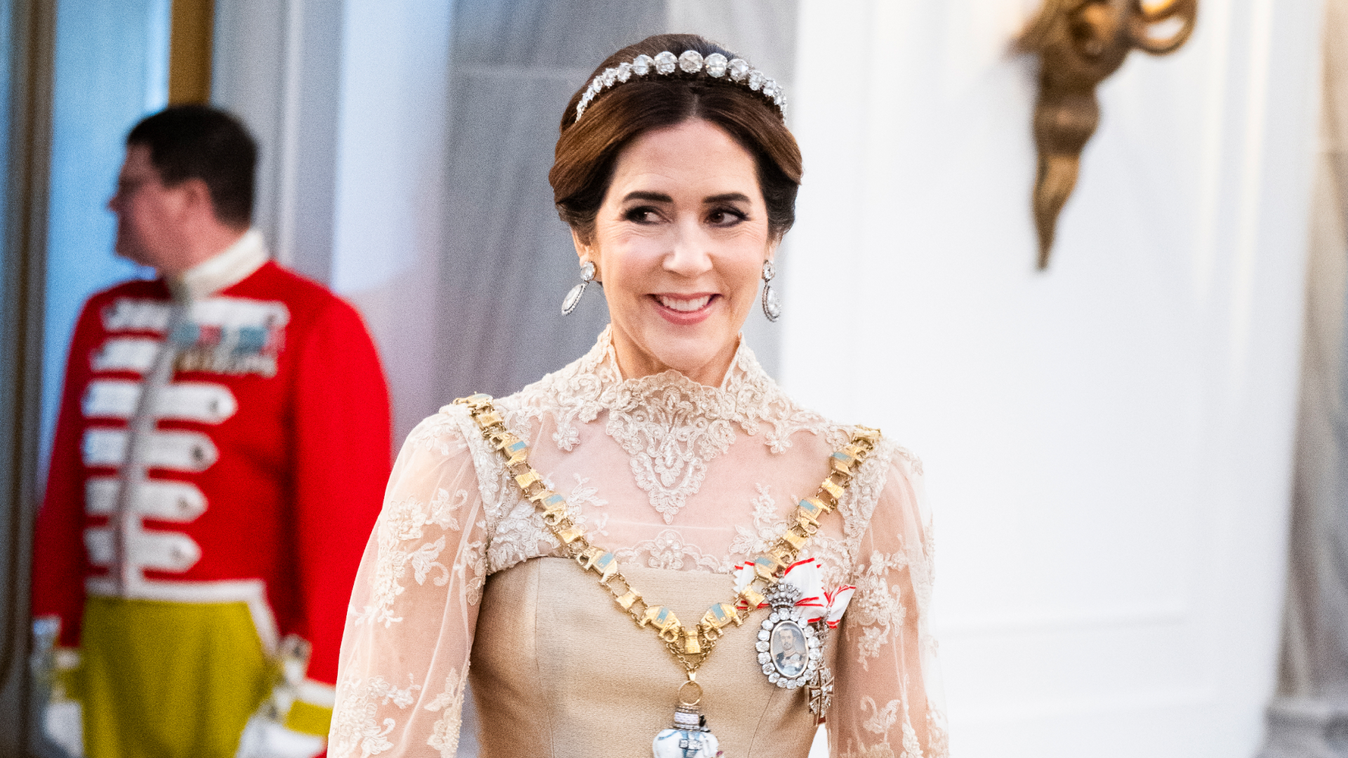 Queen Mary of Denmark attends the New Year's Day Parade hosted by her husband King Frederik X of Denmark in Copenhagen, Denmark wearing a lace and silk golden gown and a tiara on January 1, 2026 