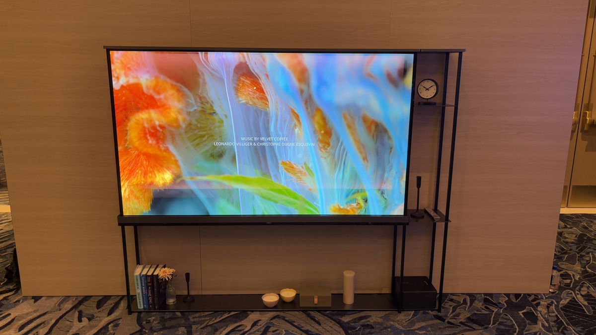 LG OLED T transparent TV against a wooden wall background