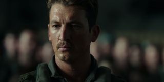 Top Gun: Maverick Miles Teller looking somber during a briefing