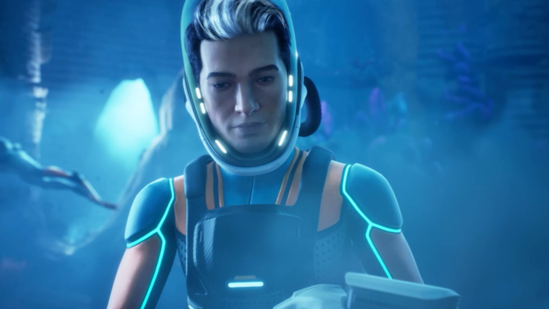 Subnautica 2 cinematic trailer screenshot shows a man underwater, wearing a suit and concentrating on something.