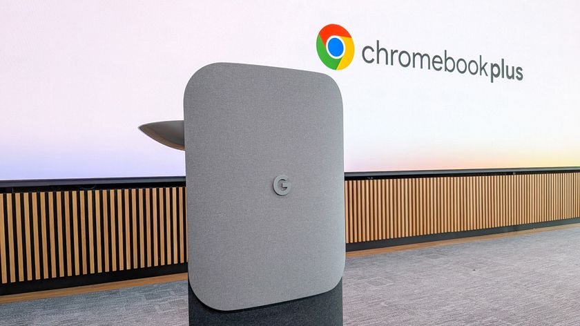 Google logo on podium with Chromebook Plus logo in the background