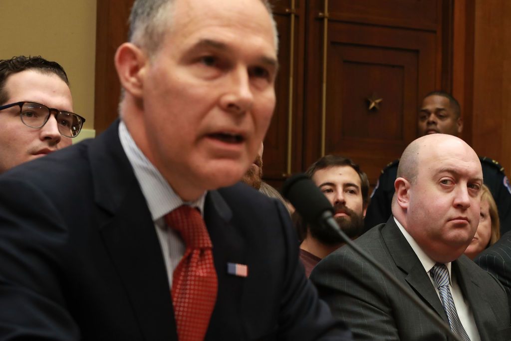 A staffer looks at Scott Pruitt.