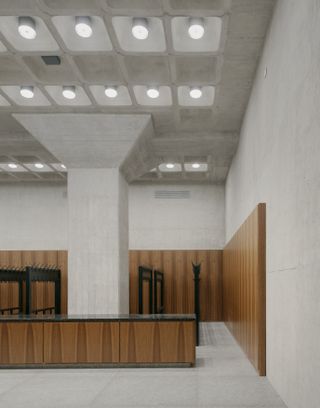 interior with concrete and wood at Neue Nationalgalerie refurbishment by David Chipperfield in Berlin