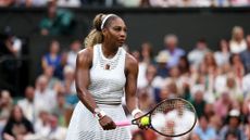 Serena Williams prepares to serve wearing white at the 2026 Wimbledon Championships.