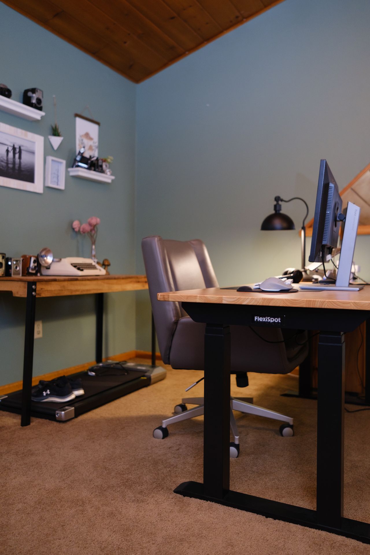 A Flexispot E7 Pro Max standing desk in an office