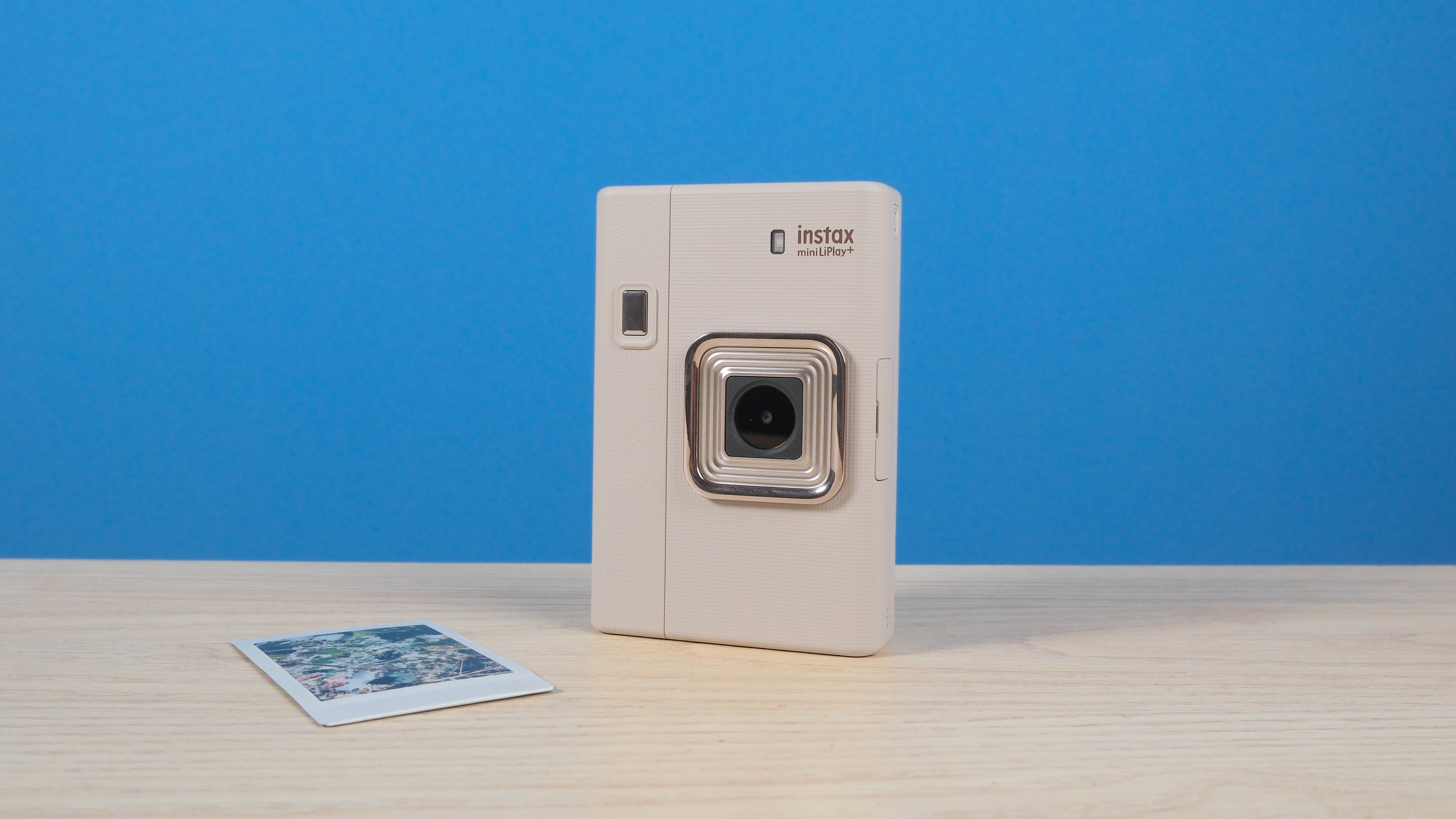 A Sand Beige Fujifilm Instax mini LiPlay Plus hybrid instant camera