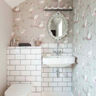 bathroom with metro wall tiles and wash basin with mirror on wall