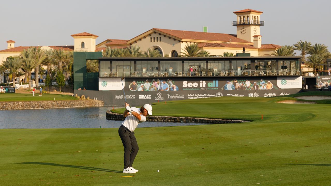 Tommy Fleetwood plays his third shot on the 18th hole during day one of the 2022 PIF Saudi International at Royal Greens Golf &amp; Country Club