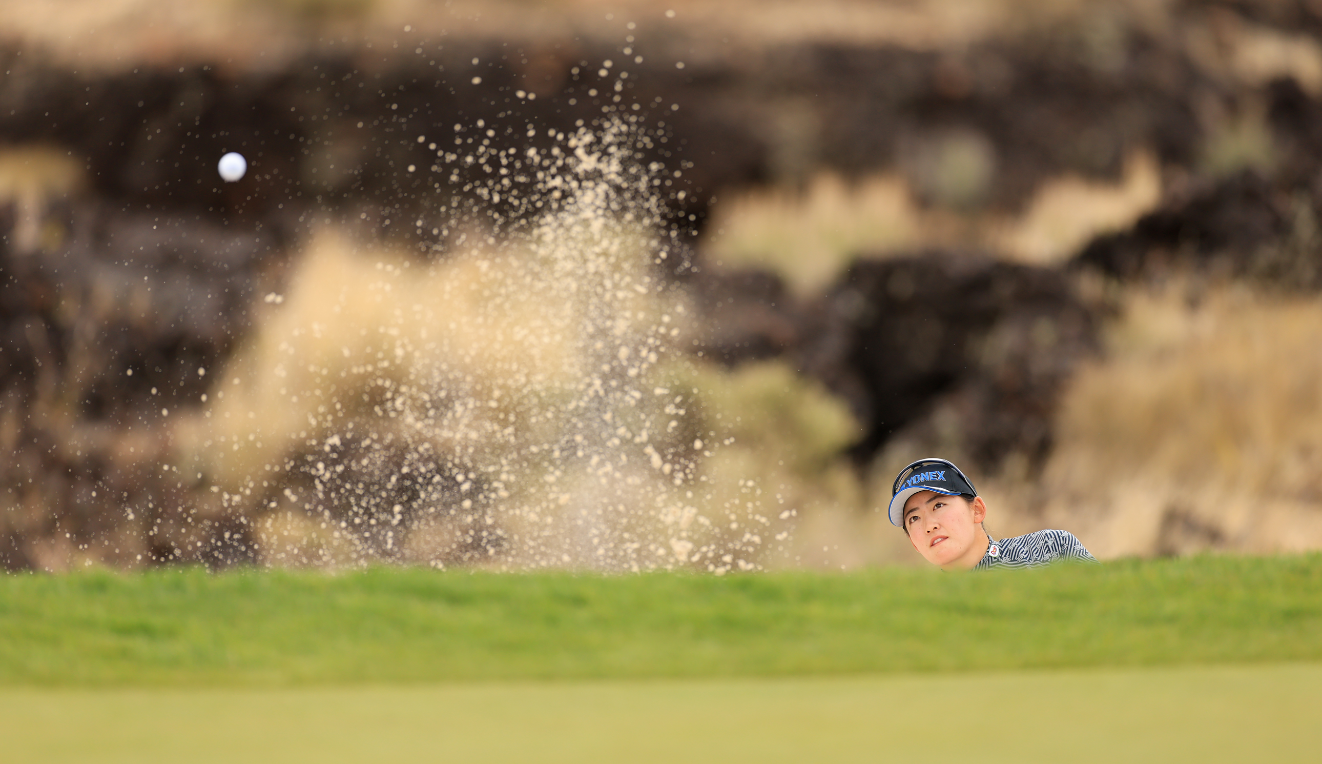 Chisato Iwai plays a bunker shot